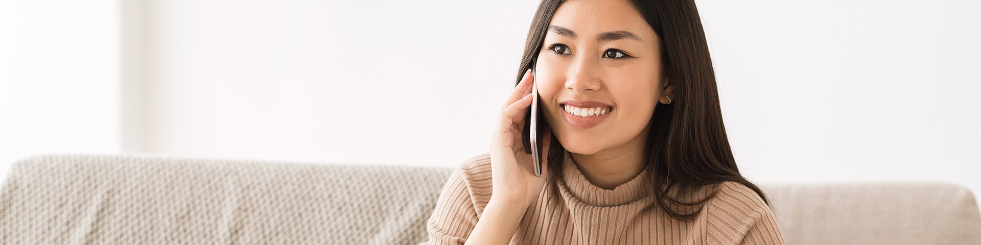 asian girl on cell phone smiling